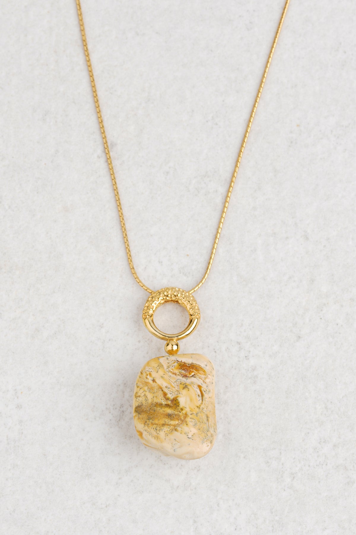 Gold-plated pendant with milky color baltic amber "Nubes Lactea"
