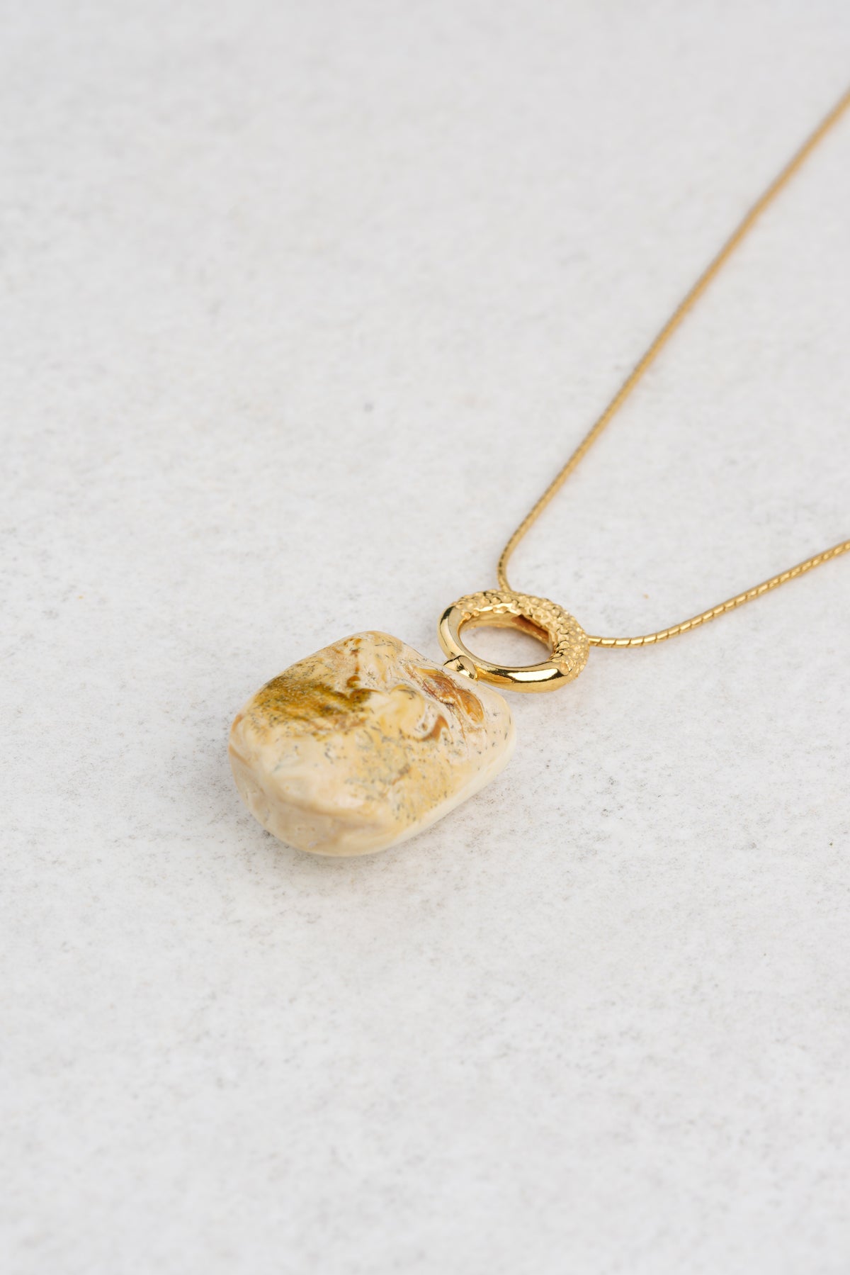 Gold-plated pendant with milky color baltic amber "Nubes Lactea"