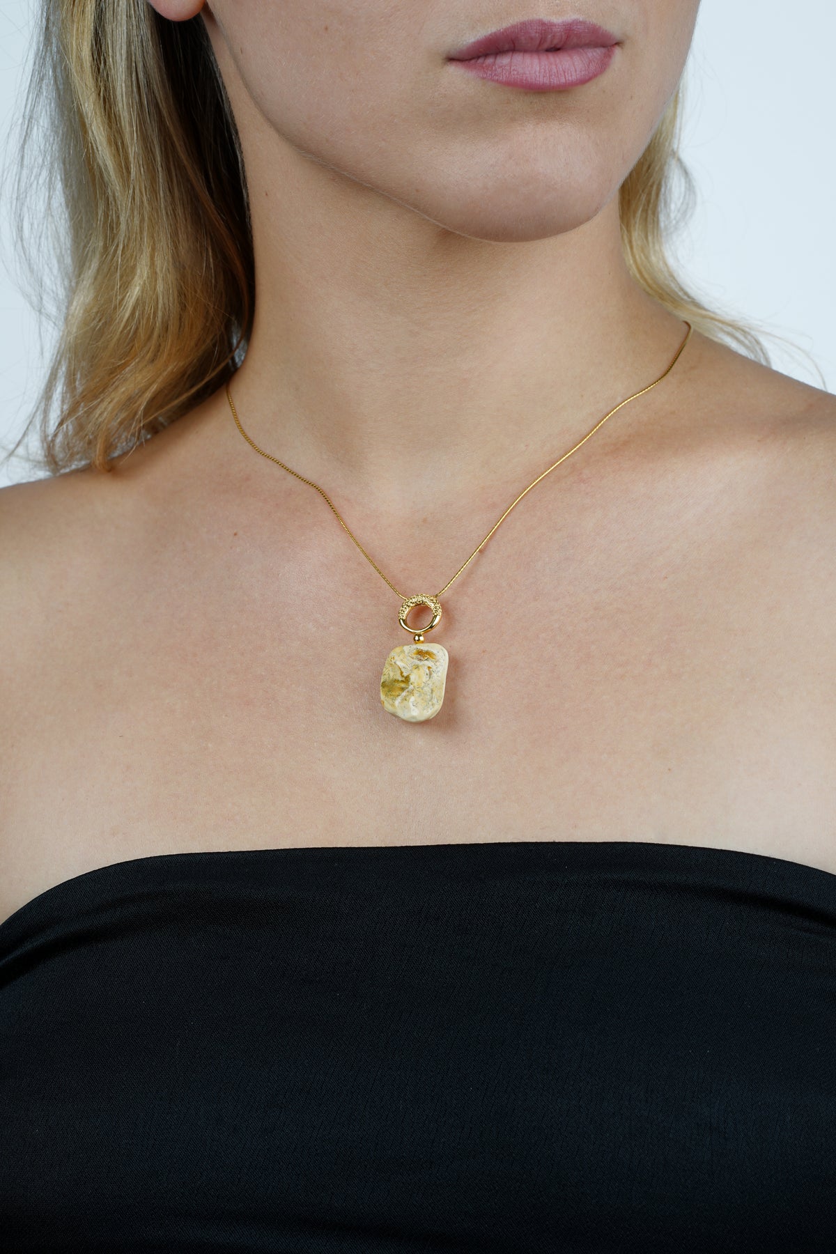Gold-plated pendant with milky color baltic amber "Nubes Lactea"